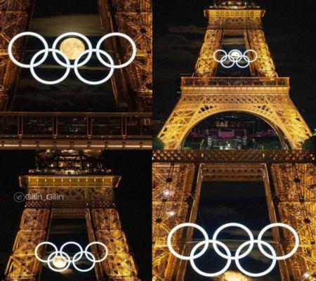 تصویر ماه برای لحظاتی در حلقه‌های المپیک بر روی برج ایفل + عکس